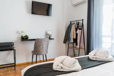 a bedroom with a bed with two towels on it at Acropolis Luxurious Legacy in Athens