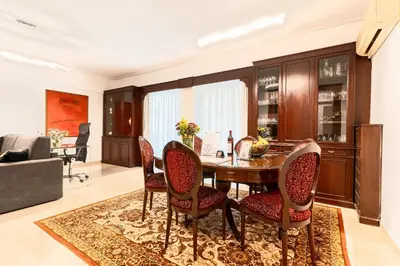 a dining room with a table and chairs at Acropolis Luxurious Legacy in Athens