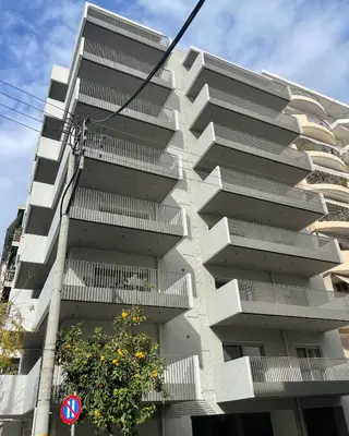an apartment building with balconies on the side of it at Bright apartment in the New building (FORM_F1) in Athens