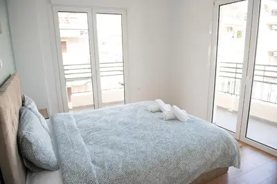 a bedroom with a bed with two stuffed animals on it at Cozy flat 5min to subway station (EPIDAMN) in Athens
