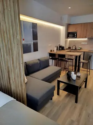 a living room with a couch and a table at Sun Marco Apartments in Athens in Athens