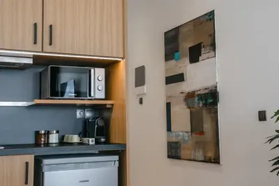 a kitchen with a microwave and a counter top at Sun Marco Apartments in Athens in Athens