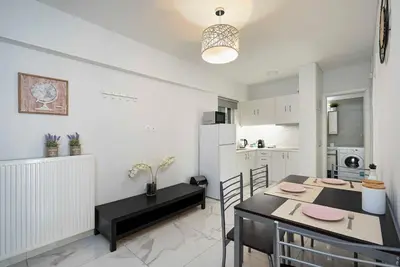 a kitchen and dining room with a table and chairs at Filoxenia MG Projects city center in Athens