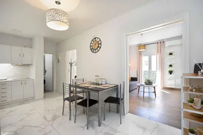 a kitchen and dining room with a table and chairs at Filoxenia MG Projects city center in Athens