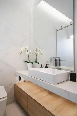a white bathroom with a sink and a toilet at Jacuzzi Luxpenthouse PFaliro in Athens