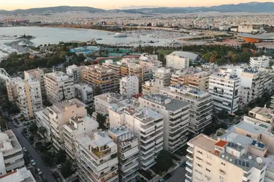 an aerial view of a city with tall buildings at Jacuzzi Luxpenthouse PFaliro in Athens