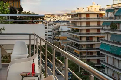 a balcony with a view of a city at Jacuzzi Luxpenthouse PFaliro in Athens