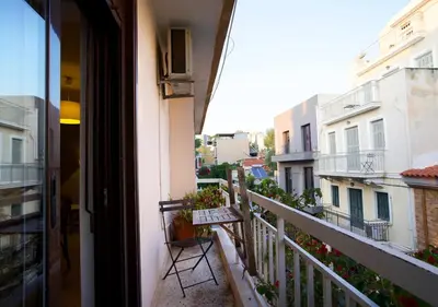 a balcony of a building with a chair on it at Live in Athens, PSYRRI Meet Me Here Apartments in Athens