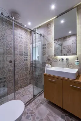 a bathroom with a sink and a shower at The Black Marble - Sea View, 2BR, 2BA in Paleo Faliro in Athens