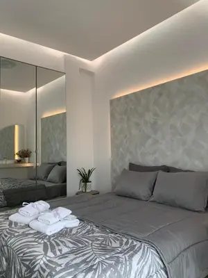 a bedroom with a large bed with towels on it at Luxury Athens Apartment with Breathtaking Views in Athens