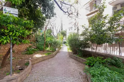 a brick walkway in front of a building at Brand new apartment in Athens in Athens