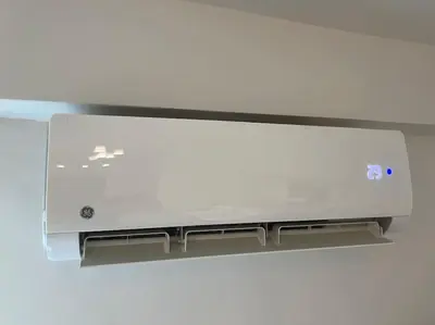 a white printer sitting on top of a wall at Chic apt near Acropolis - Avdi square in Athens
