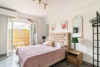 a bedroom with a large bed and a mirror at Stylish and central apt near Acropolis - Avdi square in Athens