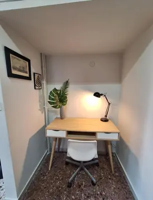 a desk with a lamp and a plant on it at Stylish and central apt near Acropolis - Avdi square in Athens