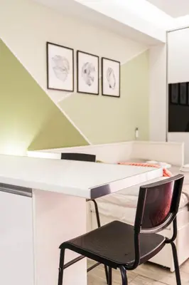 a white desk with a black chair in a room at Luxury Studio in Athens City Center in Athens