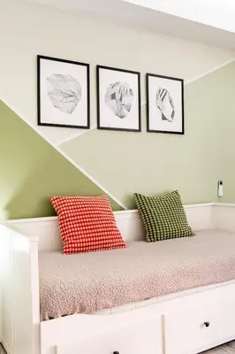 a white bench with four pictures on the wall at Luxury Studio in Athens City Center in Athens