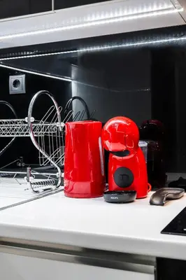 a red toaster sitting on a counter next to a microwave at Luxury Studio in Athens City Center in Athens