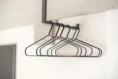 a black metal rack hanging from a ceiling at City-View Penthouse at Panormou in Athens