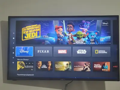 a television with a bunch of video games on it at Bovis Apartments #1 in Markopoulo