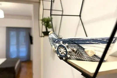 a museum exhibit of a boat on a wall at Pame Rentals - Ideal for 2 in Pagrati in Athens