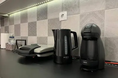 a coffeemaker and a coffee maker on a counter at Pame Rentals - Ideal for 2 in Pagrati in Athens