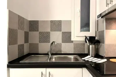 a kitchen with a sink and a counter top at Pame Rentals - Ideal for 2 in Pagrati in Athens