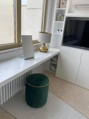 a desk with a laptop sitting on top of it at ATHENS CENTRAL APARTMENT in Athens