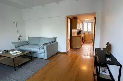 a living room with a couch and a table at Cute apartment at the foot of lycabettus hill in Athens