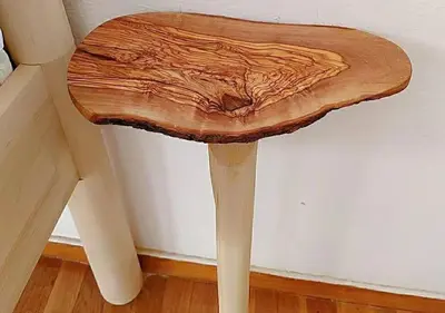 a table made out of a piece of wood at Sunny two-bedroom apartment next to Panathenaic Stadium in Athens