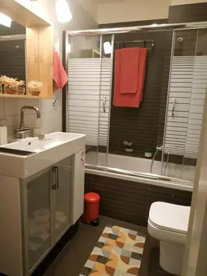 a bathroom with a sink and a toilet and a shower at Still got the blues in Athens