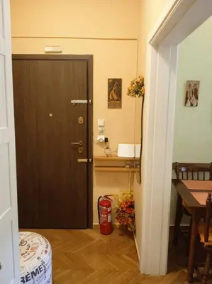 a room with a door and a table and a table sidx sidx sidx at Still got the blues in Athens