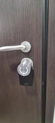 a metal door with a handle on a wooden door at Dunant Studio in Athens
