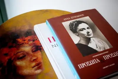 two books sitting next to each other on a table at Queen's stone legend, royal living by Acropolis in Athens