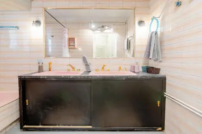 a bathroom with two sinks and a large mirror at Canto-Home Alongside The Acropolis in Athens