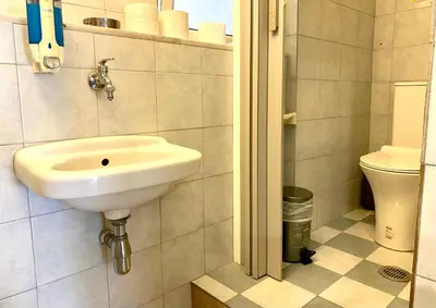 a bathroom with a sink and a toilet at Athens Victoria's studio in Athens