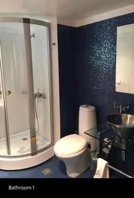 a bathroom with a toilet and a shower and a sink at Summer House / Πόρτο Ράφτη in Porto Rafti