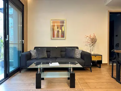 a living room with a couch and a table at T&T Luxury Apartments - Rooftop Jacuzzi in Athens