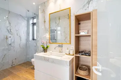 a bathroom with a sink and a mirror at ART-W Executive Apartments in Athens