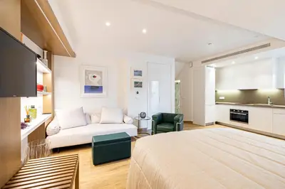 a bedroom with a bed and a couch in a room at ART-W Executive Apartments in Athens
