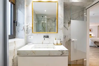 a bathroom with a sink and a mirror at ART-W Executive Apartments in Athens