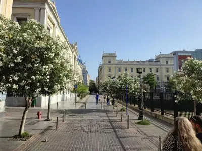 a city street with people walking down the street at Ancient Agora Hideaway in Athens