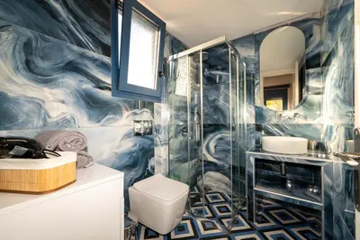 a bathroom with a shower and a toilet at Nikoli House in Vaia