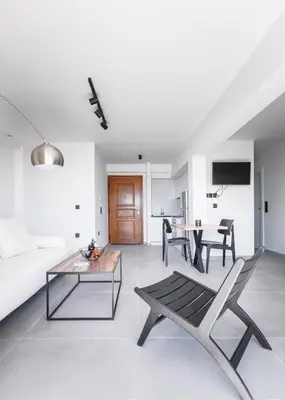 a living room with a couch and a table at Athens-Riviera apartment in front the sea Voula in Athens