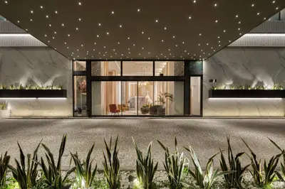 an architectural rendering of a building with plants in the foreground at Hilton Garden Inn Athens Syggrou Avenue in Athens