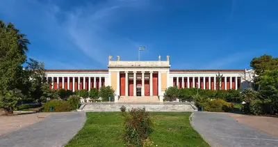 a large building with a flag on top of it at Apartment in Athens in Athens