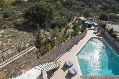 an aerial view of a swimming pool with a resort at AVAL Riviera in Lagonissi