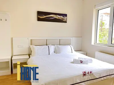 a bedroom with a large white bed with white pillows at Ammo Glyfada Residences in Athens