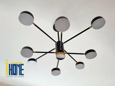 a chandelier hanging from the ceiling of a room at Ammo Glyfada Residences in Athens