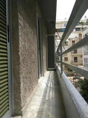 an empty balcony of a building with a window at Nice& Cozy Flat 1min from the Heart of Athens.WiFi in Athens