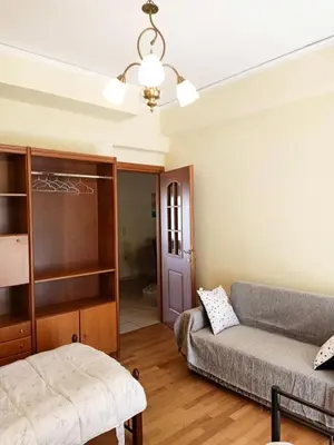a living room with a couch and a table at Bright 3bed 3bath 10 min walk Acropolis in Athens